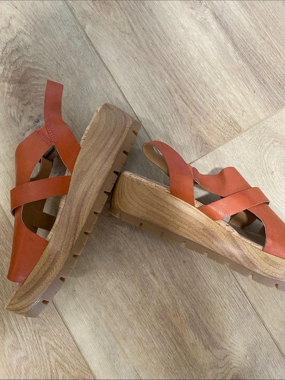 Women’s Korks platform wedge sandals feature a cork sole slingback buckle.